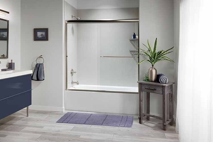 bath with glass barrier adn shower head