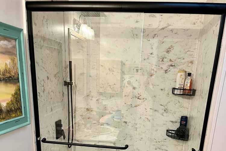 shower with glass barrier